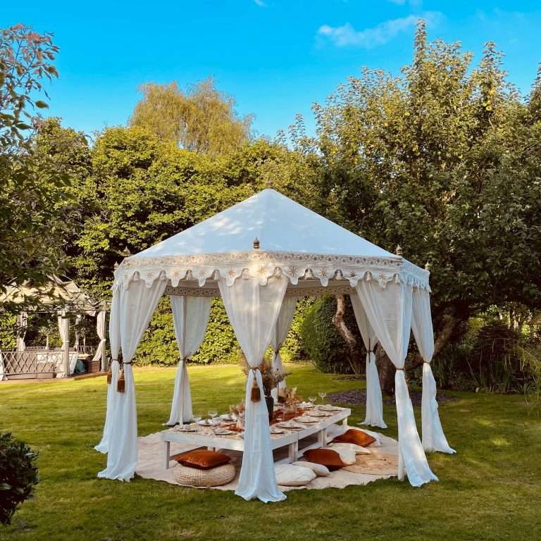 Boho Marquee set up on a sunny day with a luxe picnic for a hen party in Essex