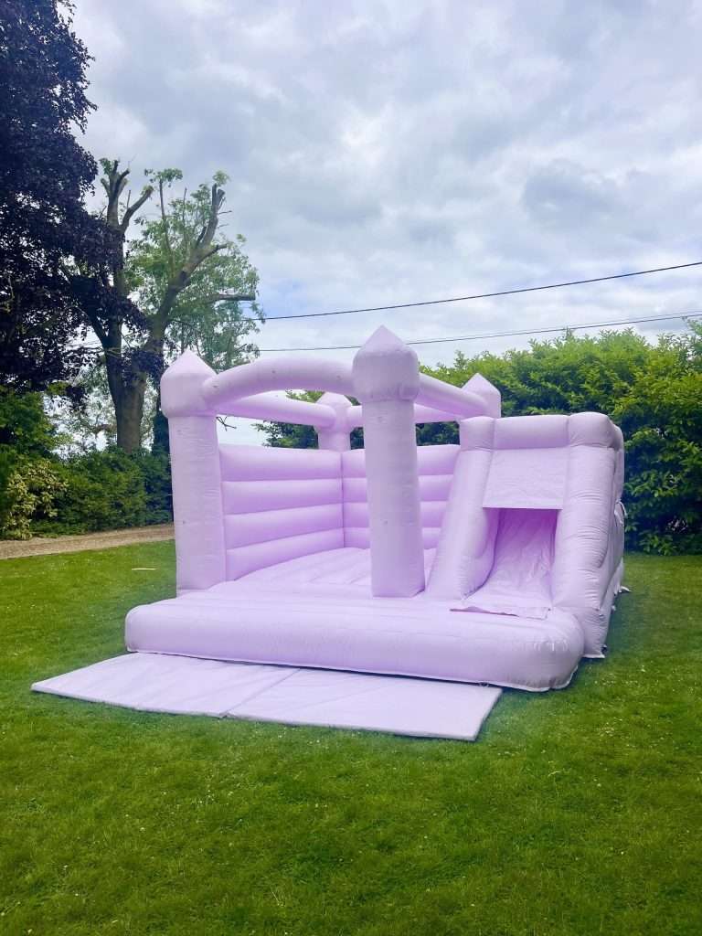 pastel lilac bouncy castle with slide
